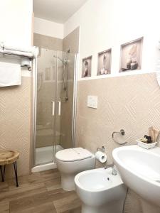 a bathroom with a toilet and a sink and a shower at Hotel Masseria Marziale in Brindisi +28 photos