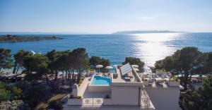an aerial view of a hotel and the ocean at Luxury Rooms Villa Jadranka in Makarska