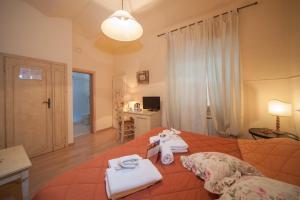 Postel nebo postele na pokoji v ubytování Albergo Etruria