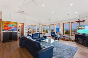 a living room with two couches and a tv at 7088 - Short II in Grun Island