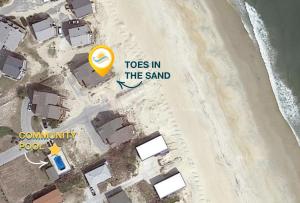 a view of a beach with a sign that reads toes in the sand at 7041 - Toes in the Sand in Whalebone +37 photos