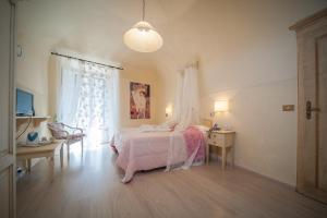Postel nebo postele na pokoji v ubytování Albergo Etruria