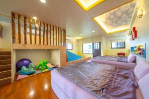 a bedroom with a bunk bed and a staircase at Lanyang Beach Villa in Wujie