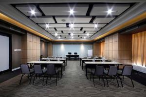 a large room with tables and chairs in it at Brits Hotel Karawang in Karawang +213 photos