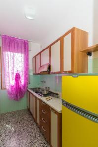 Kuchyň nebo kuchyňský kout v ubytování Residence Gabbiano