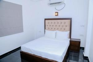 a bedroom with a bed in a room at Grand Leisure Care & Wellness Resort in Negombo +30 photos