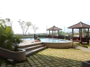 a swimming pool with a person sitting on a skateboard at Bogor Valley Hotel in Kalibata 1