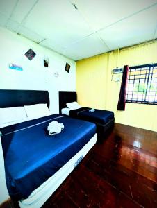 Marang Guesthouse Resort客房内的一张或多张床位