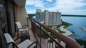 a balcony with chairs and a view of the water at Disney's Contemporary Resort in Orlando