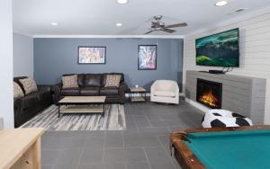 a living room with a couch and a fireplace at Whiskey Ridge in Sevierville