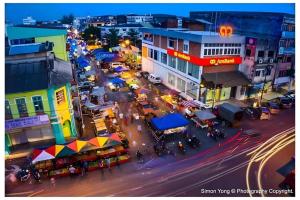 an overhead view of a busy city street at night at I-Winton Hotel in Mentekab