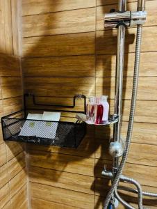 a shelf with two glasses on a wall at Chaweng Eco Parc in Ban Ko Khwan +3 photos