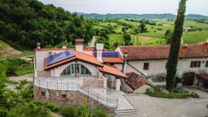 an aerial view of a house with a solar roof at Dorče Authentic Country House in Kojsko