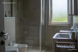 a bathroom with a shower and a sink at Apartman Damir in Malinska