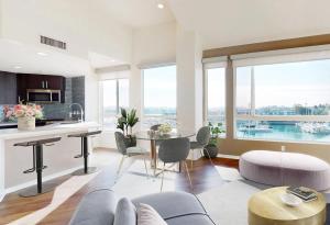 a kitchen and living room with a table and chairs at Marina Escape 2BR Townhouse with FREE PARKING in Los Angeles