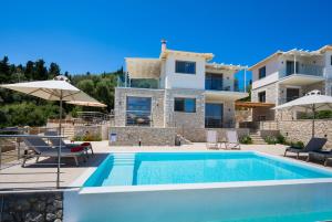 a villa with a swimming pool and a house at Diamanti Villas in Nikiana