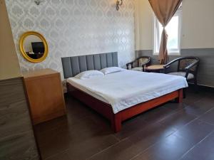 Giường trong phòng chung tại RUBY HOTEL