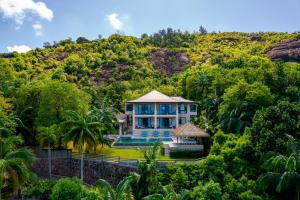 an aerial view of a house in the forest at Valmer Resort and Spa in Baie Lazare Mahé