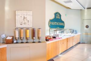 a fast food restaurant with a restaurant sign on the wall at Konstantinos Palace in Karpathos