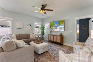 a living room with two couches and a ceiling fan at 5081 - Sound of the Cs in Kill Devil Hills