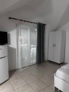 Η κουζίνα ή μικρή κουζίνα στο Vila Reni Apartament