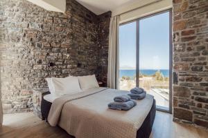 Postel nebo postele na pokoji v ubytování Villa Kera Panorama by PosarelliVillas