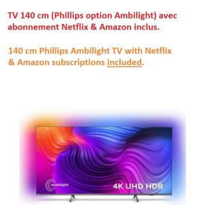 a flat screen tv with a colorful wave at T2 - Tram direct Strasbourg Centre Ville en 11 min - PARKING GRATUIT in Schiltigheim