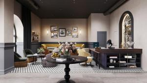 ein Wohnzimmer mit Tisch und Stühlen in der Unterkunft Jadran Heritage Hotel, Valamar Collection in Poreč + 28 Fotos