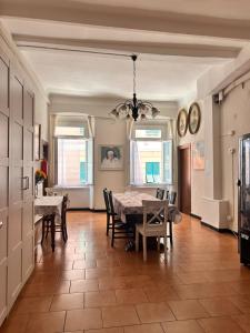 a dining room with a table and chairs at Albergo fiorita in Genoa