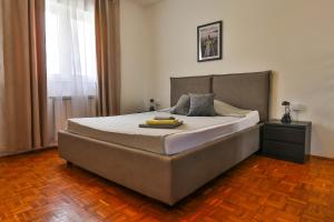 a bedroom with a large bed with a banana on it at Sonnengarten floor 1 in Marčana +11 photos