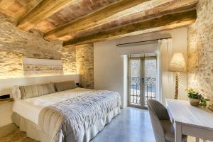 Postel nebo postele na pokoji v ubytování Can Barrull-Costa Brava-Emporda