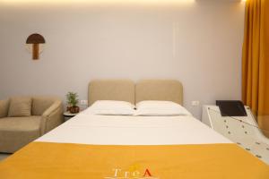 Posteľ alebo postele v izbe v ubytovaní TreA Suites
