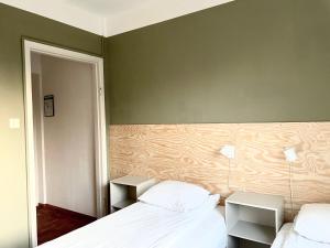Katil atau katil-katil dalam bilik di Hemmet B&B