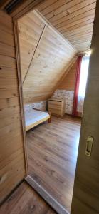 Postel nebo postele na pokoji v ubytování Apartamenty i Domki Biały Dunajec