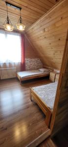 Postel nebo postele na pokoji v ubytování Apartamenty i Domki Biały Dunajec