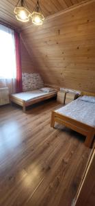 Postel nebo postele na pokoji v ubytování Apartamenty i Domki Biały Dunajec