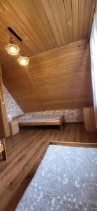 Postel nebo postele na pokoji v ubytování Apartamenty i Domki Biały Dunajec