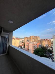 a balcony with a view of a city at Pristina Luxury Apartments 45 in Pristina