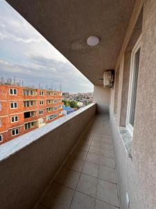 an empty balcony with a view of a building at Pristina Luxury Apartments 46 in Pristina