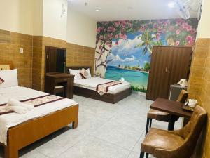 Postel nebo postele na pokoji v ubytování Dũng India Hotel
