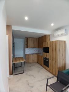 Kuchyň nebo kuchyňský kout v ubytování Butterfly Apartment