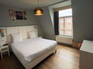 Postel nebo postele na pokoji v ubytování greet hotel Lille Gare Flandres - Groupe Accor