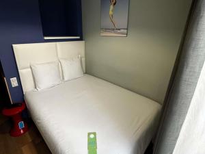 Postel nebo postele na pokoji v ubytování greet hotel Lille Gare Flandres - Groupe Accor