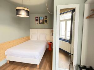 Postel nebo postele na pokoji v ubytování greet hotel Lille Gare Flandres - Groupe Accor