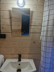 a bathroom with a sink and a mirror at Hope Mountain Escape Poland, Awesome Glamping Tent in Szczawa