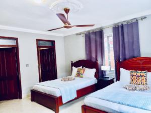 Letto o letti in una camera di Coconut Pointe Villa & Beach Resort