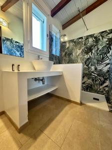 a bathroom with a sink and a shower at Luna&Limoni Country in Muravera