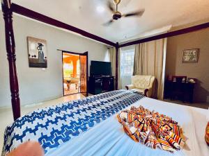 TV o dispositivi per l'intrattenimento presso Coconut Pointe Villa & Beach Resort