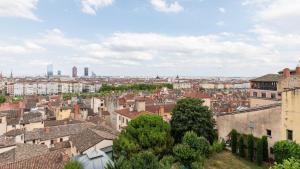 an aerial view of a city with buildings at Smartstay - Vue panoramique sur Lyon et la saone in Fourvière