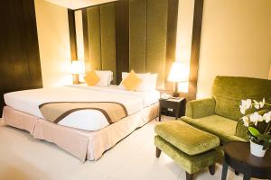 Ein Bett oder Betten in einem Zimmer der Unterkunft Intimate Hotel Pattaya - SHA Extra Plus